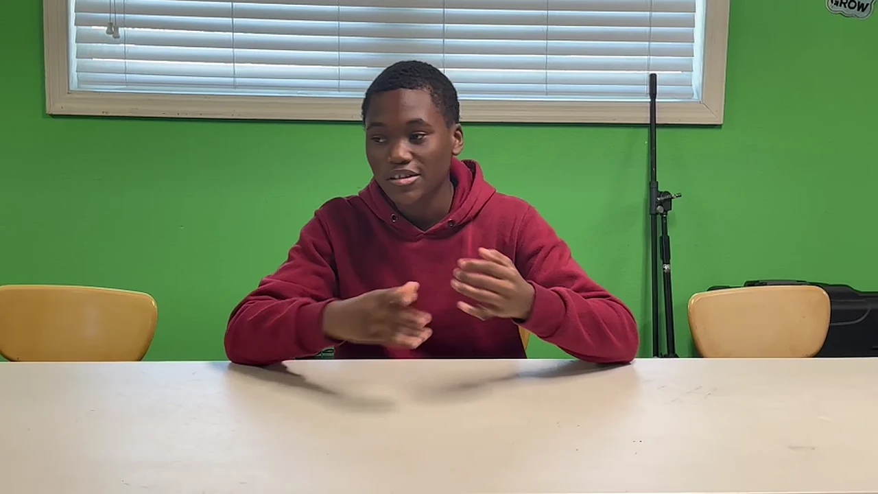 A young person practicing confident speaking during Safe Mic training